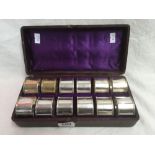 BOXED SET OF 12 NUMBERED PLATED NAPKIN RINGS