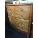 BOW FRONTED PINE CHEST OF 5 DRAWERS WITH GLASS HANDLES