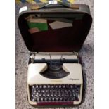 PORTABLE OLYMPIA TYPEWRITER IN TARTAN CARRY CASE