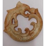 ORIENTAL JADE DISC DEPICTING A DRAGON CHASING A PEARL,