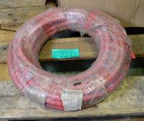 Reel of Red rubber tubing