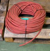 Reel of Red rubber tubing