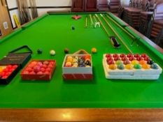 E.J Riley Ltd. Snooker table with multiple accessories