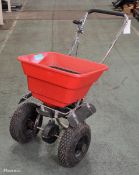 Hand operated push salt spreader