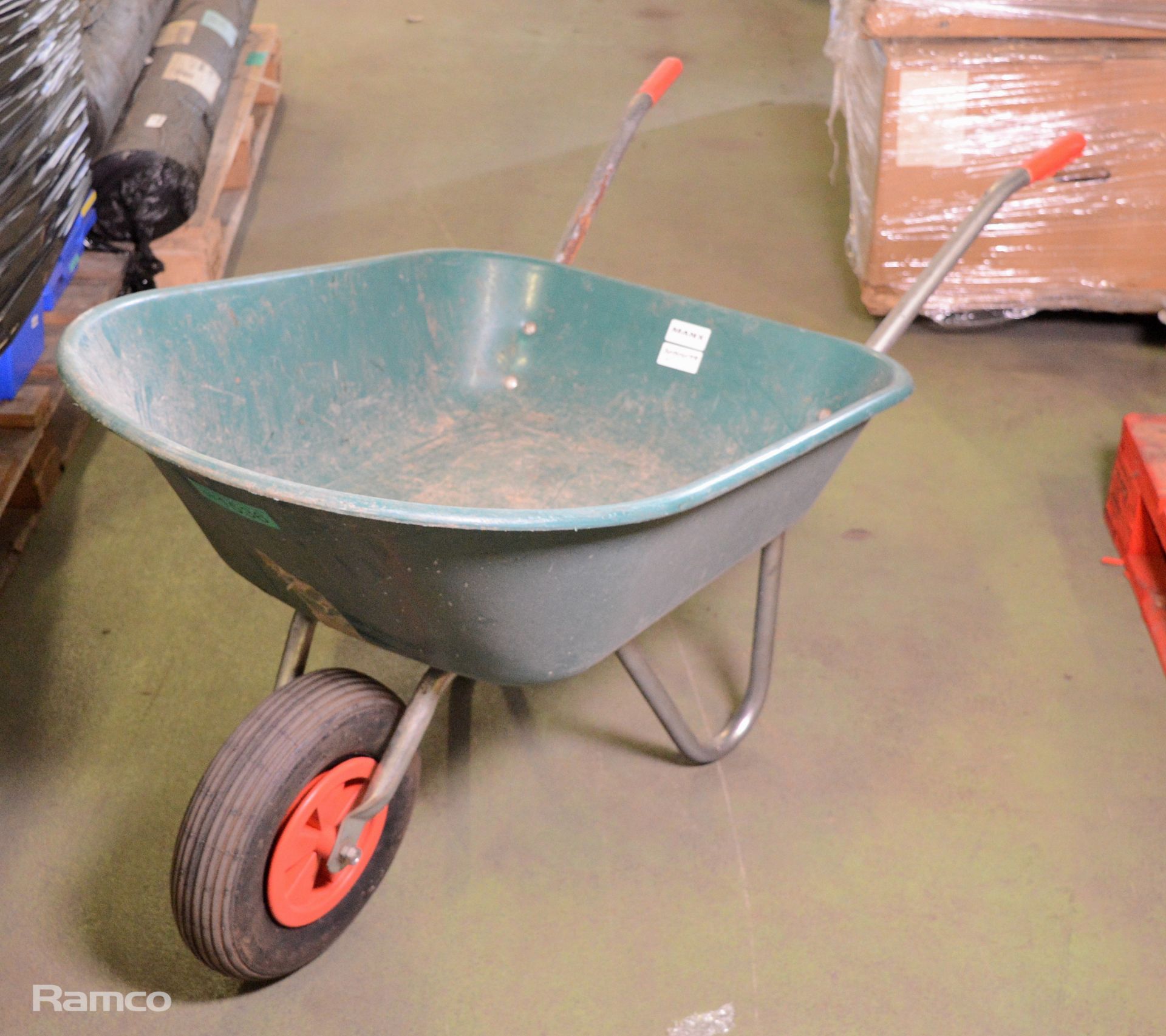 Plastic wheelbarrow with metal frame