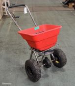 Hand operated push salt spreader