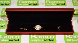 Pearl Biography gold coloured bracelet with central pearl