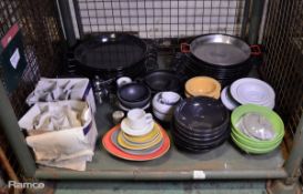 Assorted catering items plates, bowls, glasses, paella pans