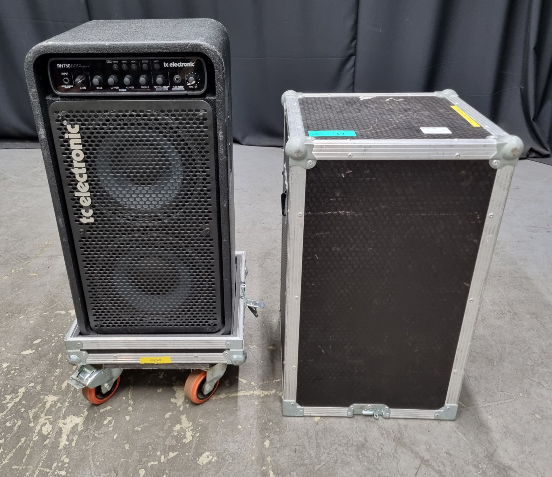 TC Electronic RH750 Class D bass amplifier in swan flight case on castors