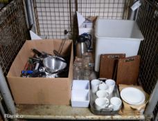 Stillage of kitchen equipment incl. utensils, plates & cups