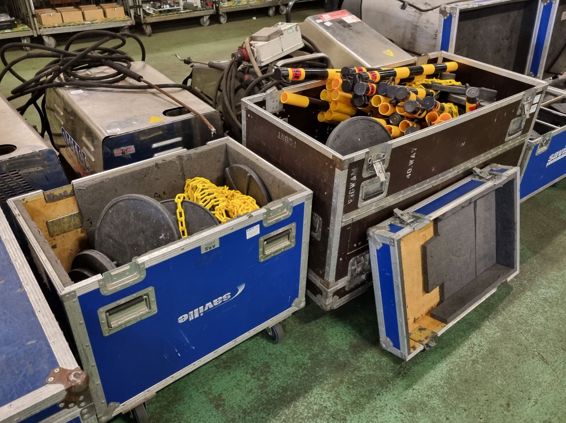 Yellow and black chain link fencing with bases in flight cases on castors - Image 4 of 6