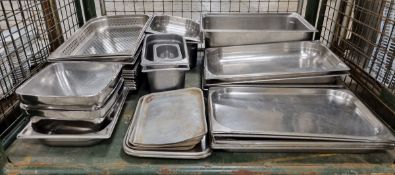 Catering equipment and supplies consisting of stainless steel trays of assorted sizes