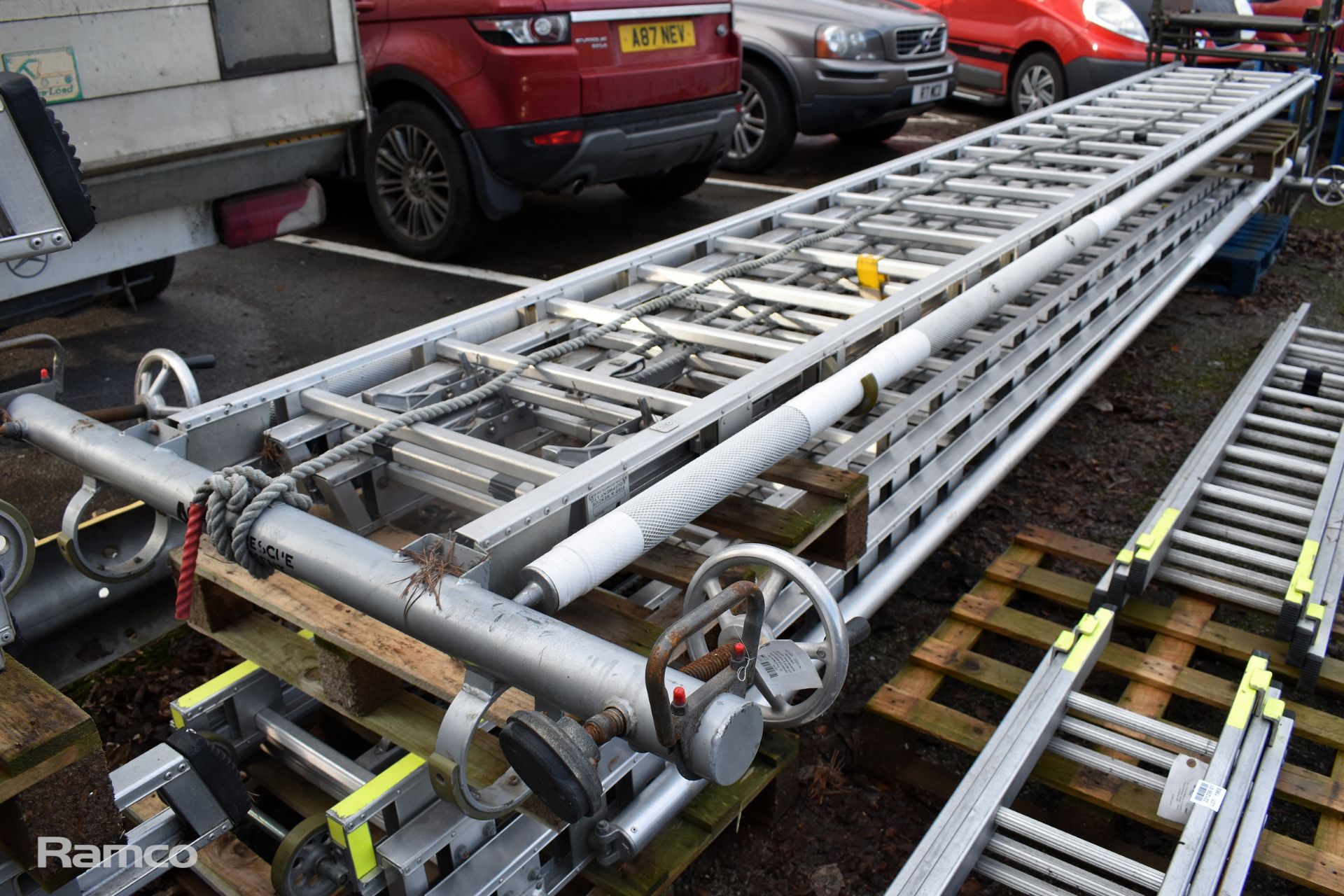 Ex - Fire & Rescue rope-operated triple extension ladder with stabilising support poles - Image 3 of 5