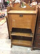 An oak Arts & Crafts fall front bureau, with broken swan neck gallery to top above a fall front with