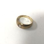 A 9ct gold ring with gypsy set diamond (R) (3.42g)