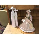 A Spanish Lladro style porcelain figure, Two Nuns (35cm) and a composition figure group, Reading