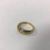 A 9ct gold gypsy set ring set single diamond (P/Q) (3.51g)
