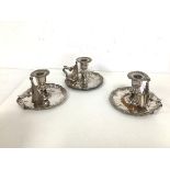 A set of three plated chamber candlesticks (each: 10cm)