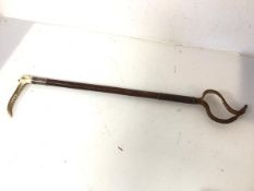 A 1930s racing strop with bone handle and white metal collar (50cm)
