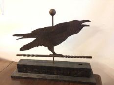 A sheet metal table sculpture of a Raven on wooden base (48cm x 60cm x 15cm)
