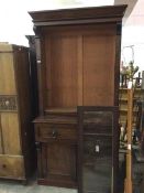 A mid 19thc bureau bookcase, the moulded cornice above two glazed doors, and adjustable shelves,