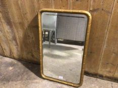 A 19thc gilt rectangular wall mirror, with beaded border and bevelled plate (74cm x 46cm)