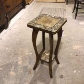 A South East Asian plant stand, with square top with carved foliate decoration, on curved supports