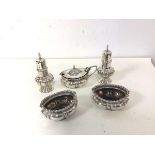 A pair of Walker & Hall silver pepperettes and salts and a silver condiment pot (5)