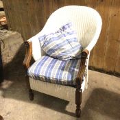 A 1920s/30s armchair, with painted white wicker back and seat, padded seat cushion, on spring