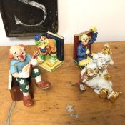 A Capodimonte figure of a Clown Seated, the Italian label describes Limoges and Swarofski (17cm) A