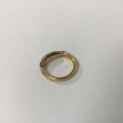 An 18ct gold wedding band, with 9ct reducing bar (J with bar) (3.7g)