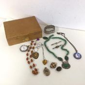 A collection of costume and silver jewellery including an irridescent moth wing pendant in silver