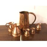 A large copper water jug (28cm), a set of measures including a pint, half pint, a half gill, a