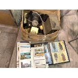 A mixed lot including two albums containing vintage postcards and a quantity of vintage