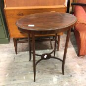 An Edwardian mahogany plant stand with moulded top, with plain frieze, on straight supports united