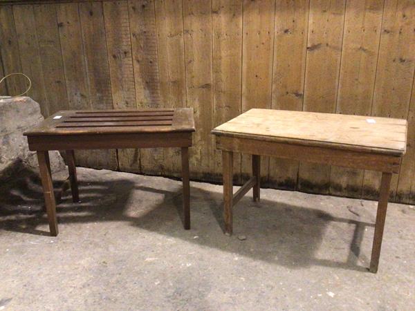 A near pair of Edwardian luggage stands, one with later plank top, one with John Taylor & Sons,