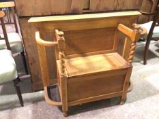 A modern oak hall bench, with hinged seat flanked by two umbrella stands, complete with drip