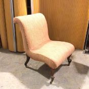 A Victorian slipper chair in later upholstery, with scroll back on moulded front supports