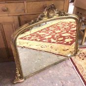 A late 19thc/early 20thc overmantle, with domed top glass within a foliate crest topped gilt metal