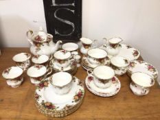 A Royal Albert Old Country Rose pattern tea service with six teacups and saucers, teapot (19cm), two