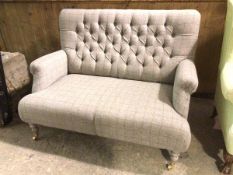 An Anta style contemporary two seater sofa in soft grey tweed upholstery with button back with