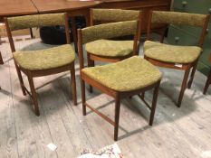 A set of four Mackintosh model no.9533 chairs, with curved back rests above upholstered seats, on