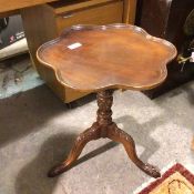 A reproduction mahogany Georgian style occasional table with undulating dished top, with QC1D