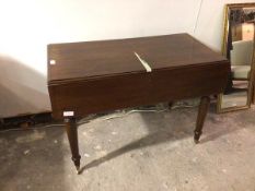 A reproduction mahogany pembroke table, the rectangular top with twin drop flaps and plain frieze,