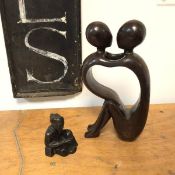 A cast metal figure of a Seated Chinese Scholar and a composition sculpture of two abstract figures,