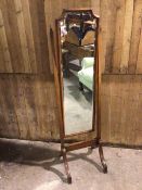 A 1930s/40s cheval mirror, with bevelled glass on hinged trestle support (160cm x 45cm x 43cm)