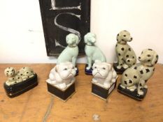 A group of ceramic dog ornaments including two celadon green dogs, stamped Librasco, Japan to