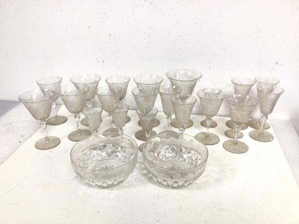 A set of cut glass stemware including sherry glasses, wine glasses, port glasses (largest: 13cm x