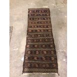 A kelim runner with multiple rows of geometric patterns (160cm x 59cm)