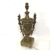 A classically inspired gilt metal and stone effect table lamp of urn form with griffin handles to